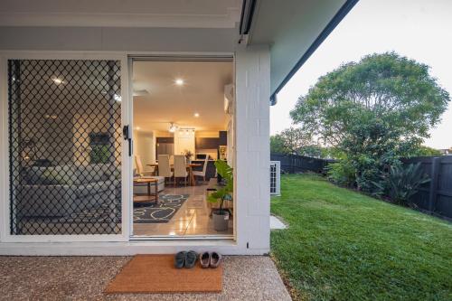 a screened in porch with a view of a yard at Nora Poolhouse Oasis, 4-beds house, North Lakes in North Lakes