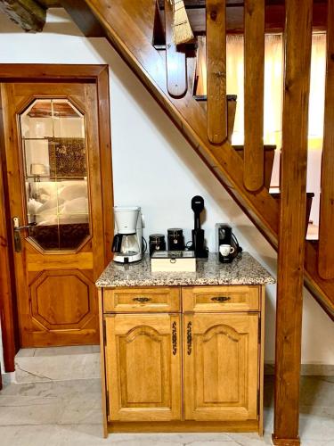 a kitchen with a counter and a staircase at Eleni's Traditional House in Afantou