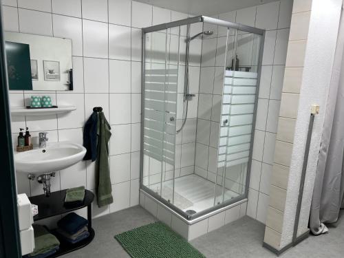 a bathroom with a shower and a sink at Schwarzwald Lodge EG - Perfekt für Familien in Calw