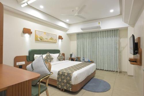 Ένα ή περισσότερα κρεβάτια σε δωμάτιο στο Hotel Grand Arose