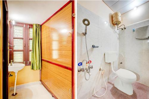 a bathroom with a shower and a toilet and a sink at Super Hotel O Chittoor Railway Station Formerly Four Oaks in Chittoor