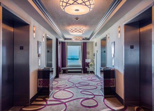 a hallway of a hotel lobby with a large carpet at Harrah's Gulf Coast, A Caesars Destination in Biloxi