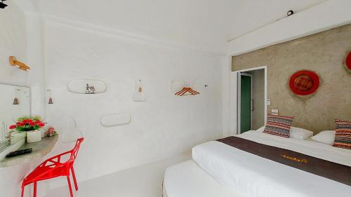 Postel nebo postele na pokoji v ubytování The Buda Resort Muaklek