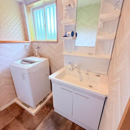a bathroom with a toilet and a sink at 民泊御座岬 Minpaku Gozamisaki in Goza