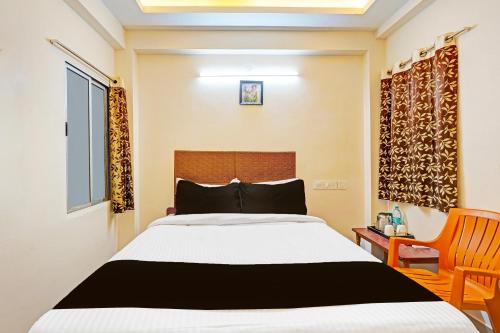 Postel nebo postele na pokoji v ubytování Super Hotel O Purasaiwalkam