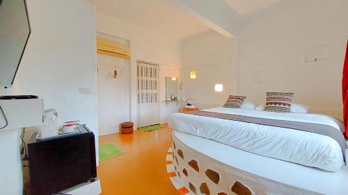 Postel nebo postele na pokoji v ubytování The Buda Resort Muaklek