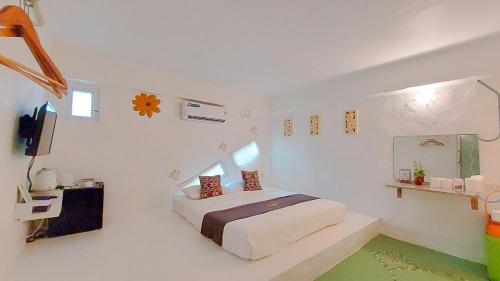 Postel nebo postele na pokoji v ubytování The Buda Resort Muaklek