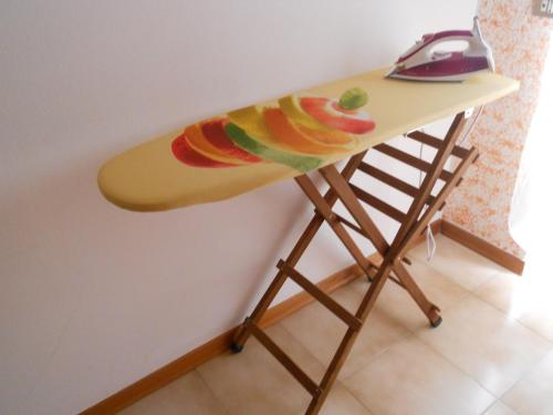 a surfboard on a table with fruit on it at Pepita Flats in San Salvo
