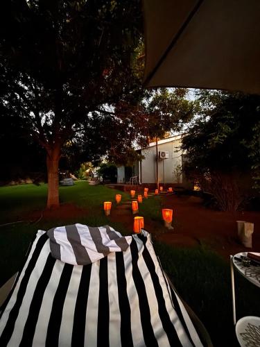 a black and white striped table in a yard at 7 on West in Postmasburg
