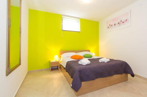 a bedroom with a bed with two towels on it at Villa Patricija Keller-PODRUM-BASEMENT in Poreč