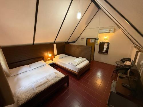 En eller flere senge i et værelse på Koh Yor Resort เกาะยอรีสอร์ท