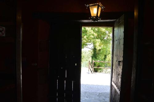 an open door with a light on top of it at Mas Sabaters - L'Era de Sabaters in Tavernoles