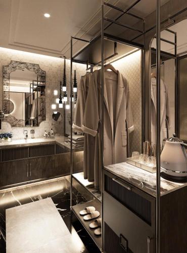 a bathroom with a sink and a dressing room at Manevi Premier Hotel in Hanoi
