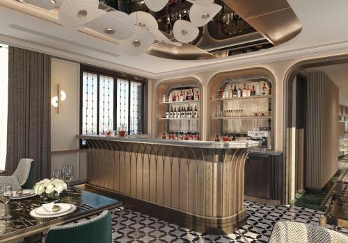 a bar in a restaurant with a table and chairs at Manevi Premier Hotel in Hanoi