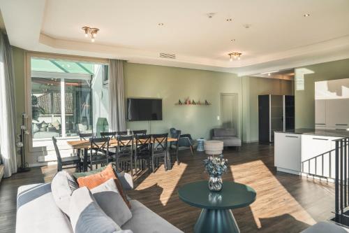 a living room with a couch and a table at HOP Apartments & Suites in Interlaken