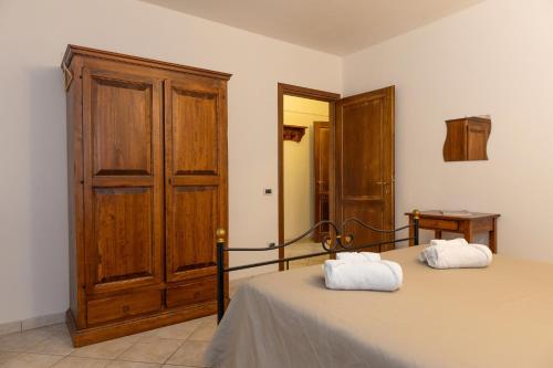Ένα ή περισσότερα κρεβάτια σε δωμάτιο στο Borgo San Carlo