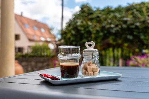 a plate with a glass jar of tea and a spoon at Villa Roteluft - Pablo in Barr