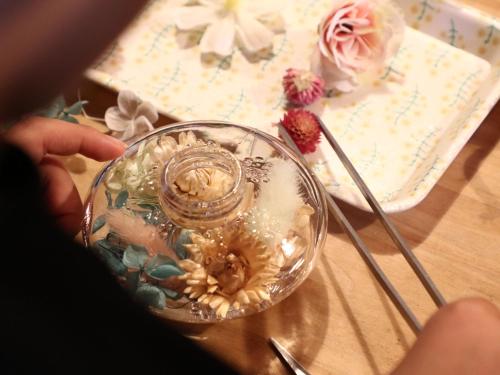 a glass dish with shells in it on a table at kamino Terrace, a Japanese history and nature experience accommodation in Wakakuri