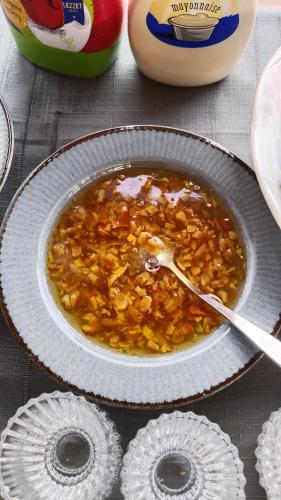 a bowl of food with a spoon in it at Ekoton Cave Hotel in Nevsehir