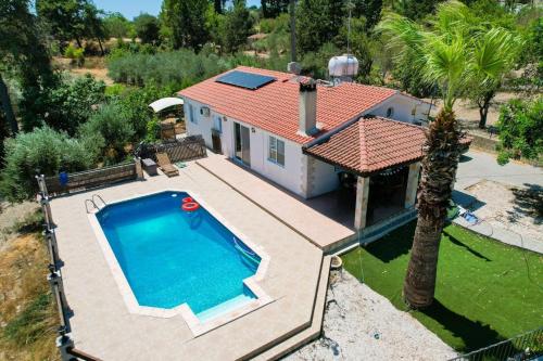 an aerial view of a house with a swimming pool at Villa in Kallepia-Luxurious stay in Paphos City