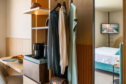 a closet in a bedroom with a bed at Hotel San Giorgio Resort 4S in Caorle