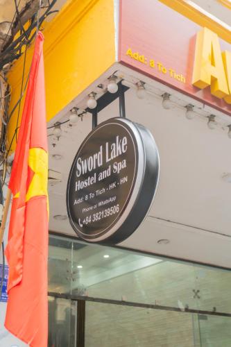 a sign for a snow lakeoked and spa in a store at Sword Lake Hostel and Spa in Hanoi