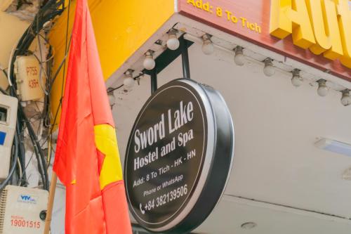 a sign for a sushi table in a restaurant at Sword Lake Hostel and Spa in Hanoi