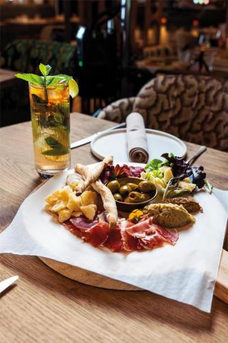 a plate of food on top of a table at Radisson Collection The National Hotel, Brussels in Zaventem
