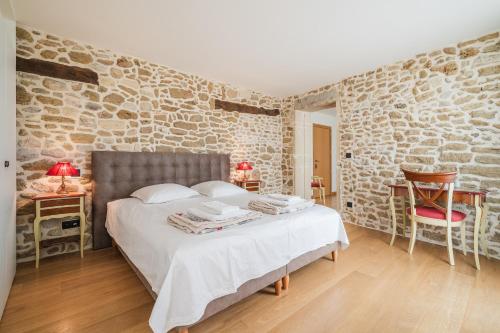 Postel nebo postele na pokoji v ubytování Domaine de la Calamande
