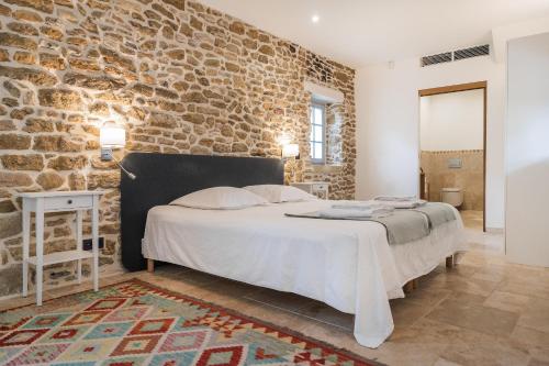 Postel nebo postele na pokoji v ubytování Domaine de la Calamande