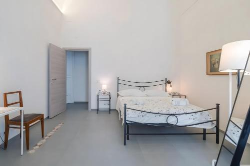 Una cama o camas en una habitación de Camera matrimoniale
