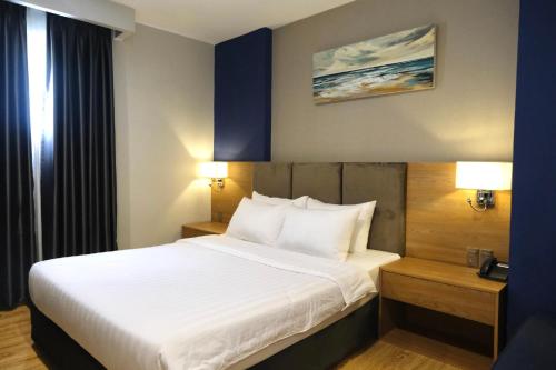 En eller flere senge i et værelse på Galaxy Hotel - Ben Thanh Market