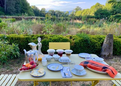 a table with a tray of food on it at Château du Bouy in Champétières