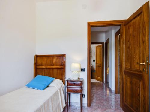 a bedroom with a bed and a table and a chair at Pet-Friendly Villa with Pool in Urbino