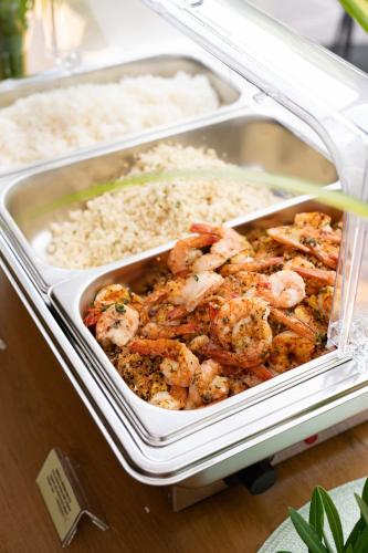 a tray of food with shrimp and rice at Elite Atoll Serviced Apartments Phuket in Rawai Beach