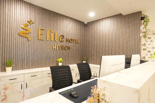 an office with a sign on the wall at Elite Hotel HITECH in Hyderabad