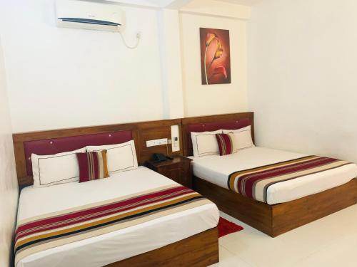 Ένα ή περισσότερα κρεβάτια σε δωμάτιο στο Hotel Moonstone