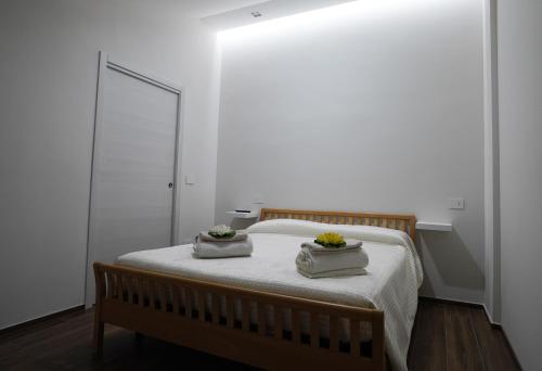 Ένα ή περισσότερα κρεβάτια σε δωμάτιο στο Terrazza Belvedere