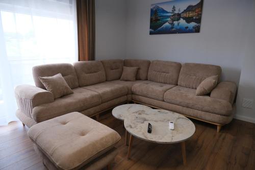 a living room with a couch and a coffee table at Eden House in Kukës