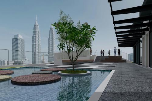 a building with a pool with a tree in it at Marriott Executive Apartments Kuala Lumpur in Kuala Lumpur