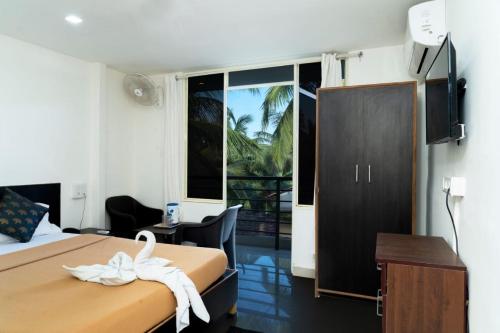เตียงในห้องที่ Bliss Holiday In