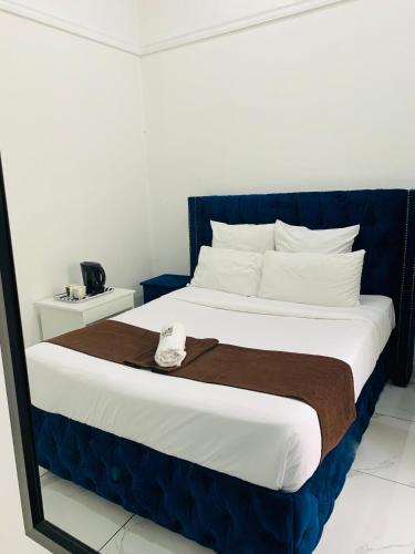 Ένα ή περισσότερα κρεβάτια σε δωμάτιο στο De Dreamz Guest House