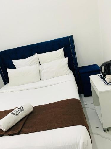 Ένα ή περισσότερα κρεβάτια σε δωμάτιο στο De Dreamz Guest House