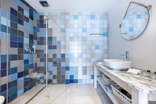 a bathroom with a sink and a shower at Casa da Praça - Vila do Bispo, Algarve in Vila do Bispo