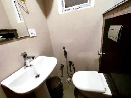 a bathroom with a sink and a toilet at Hotel RN Residency - Near Prem Mandir Vrindavan in Vrindāvan