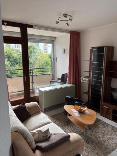 a living room with a couch and a table at Francis Appartement am Mountainbike-Park in Winterberg