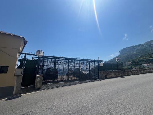 a gate on the side of a road at Idillioravello in Ravello
