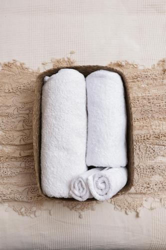 a tray filled with towels on a table at Beyt El Midan in Ehden