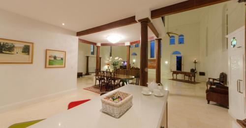 a living room with a table and a dining room at Broken Hill Outback Church Stay in Broken Hill