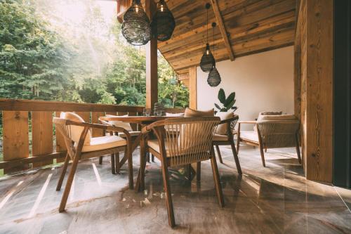 a dining room with a table and chairs at Boutique Alpi - Art of Chalet in Grainau